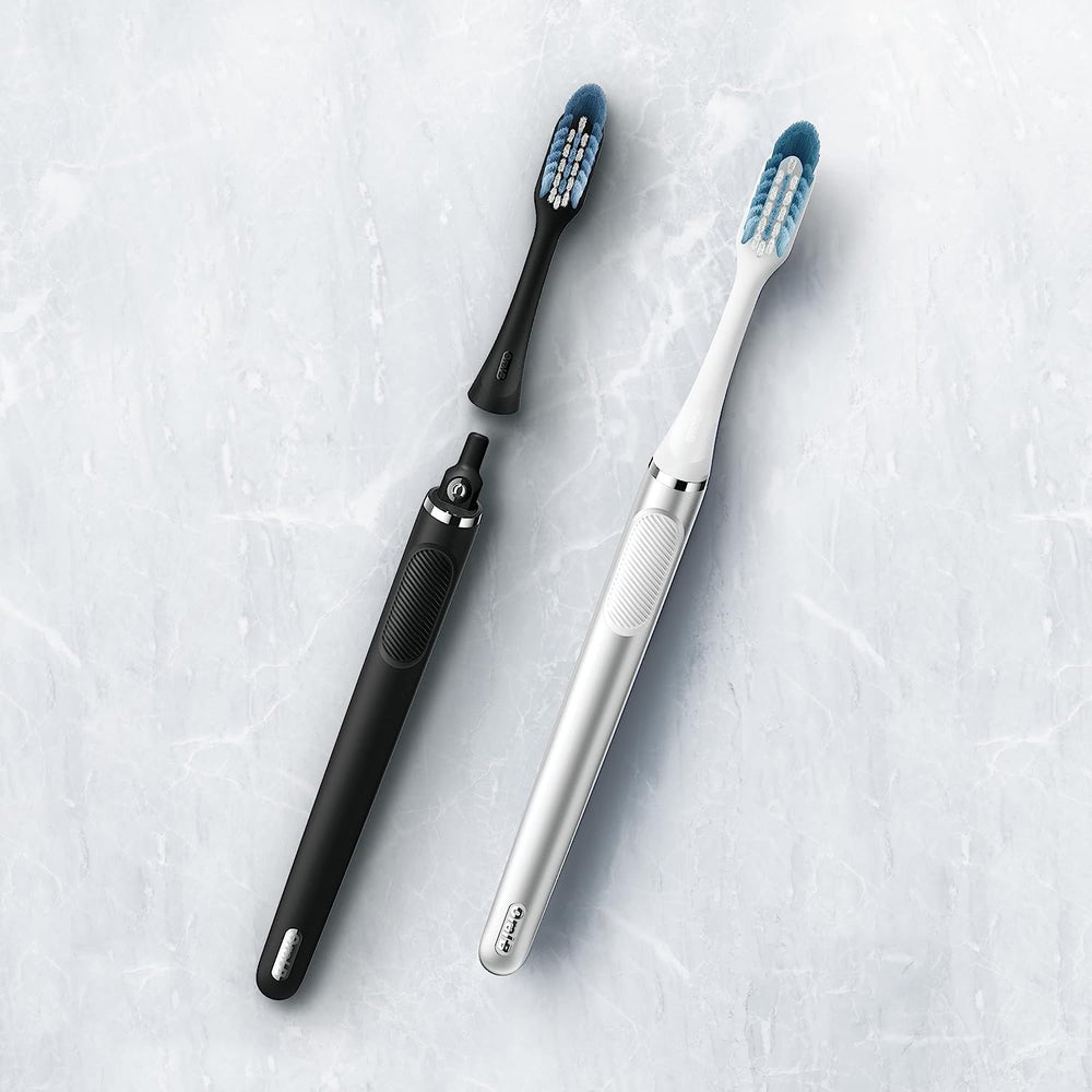 Oral-B Clic branding with replacement heads in black