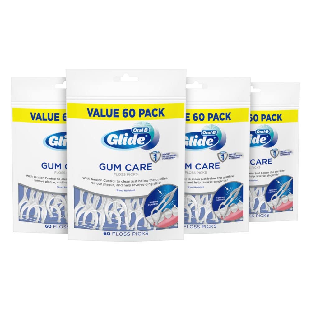 Front view of four 60-count bags of Oral-B Glide Gum Care floss picks