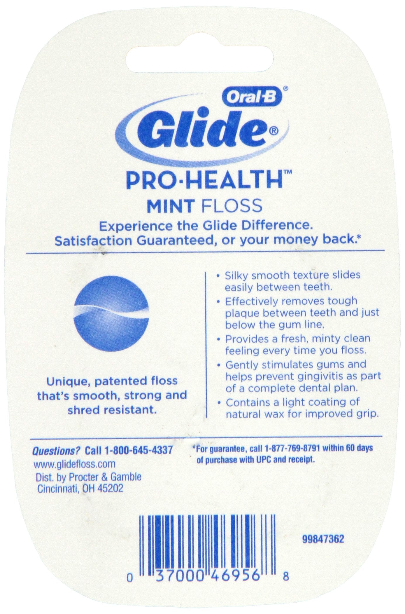 Close-up of Oral-B Glide Floss Mint 54.6 Yard being unspooled