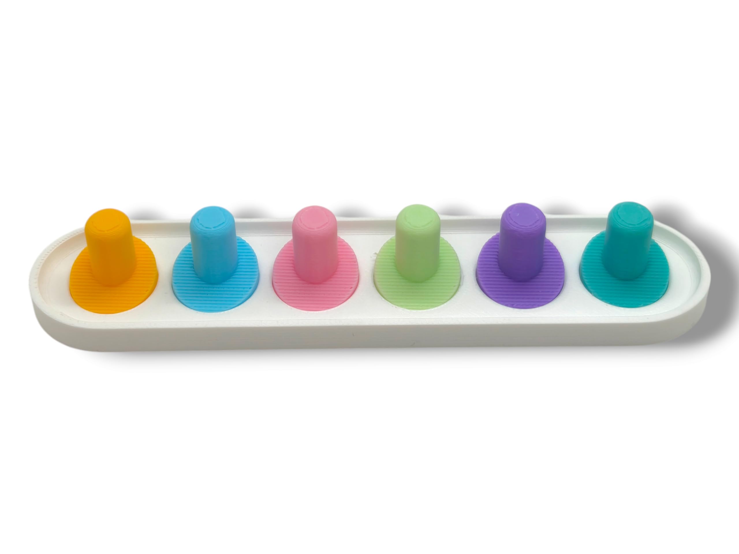 Pastel pink Oral-B iO toothbrush head holder with heads