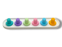 Pastel green Oral-B iO toothbrush head holder on bathroom counter