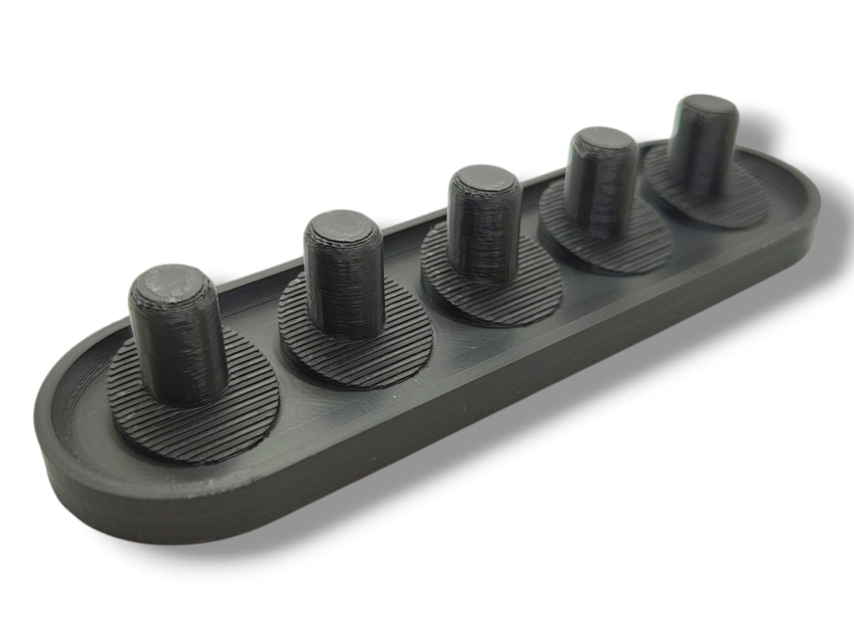 Black 3D-printed Oral-B iO toothbrush head holder holding up to 6 heads