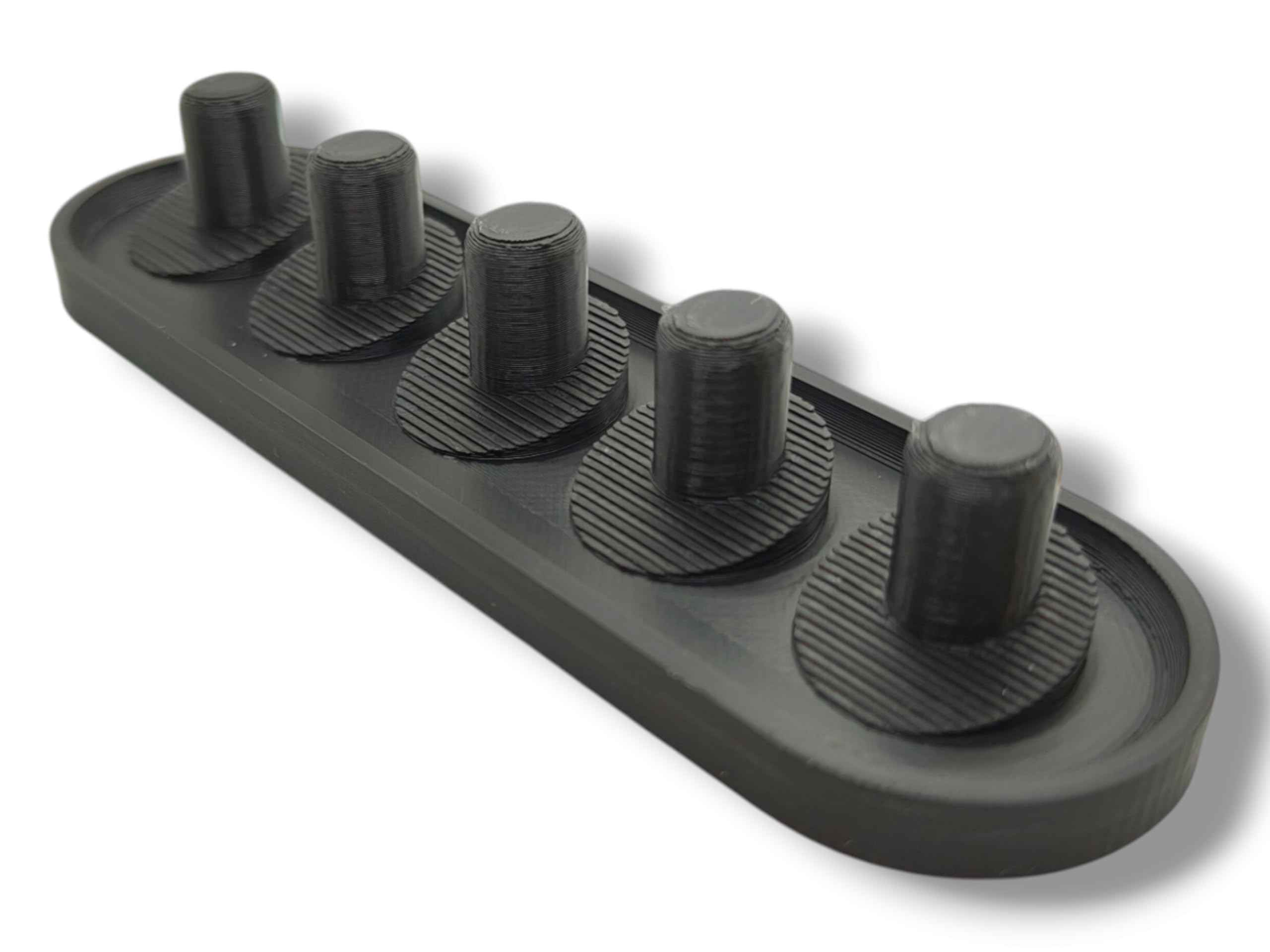 Close-up of black Oral-B iO head holder showing sleek design