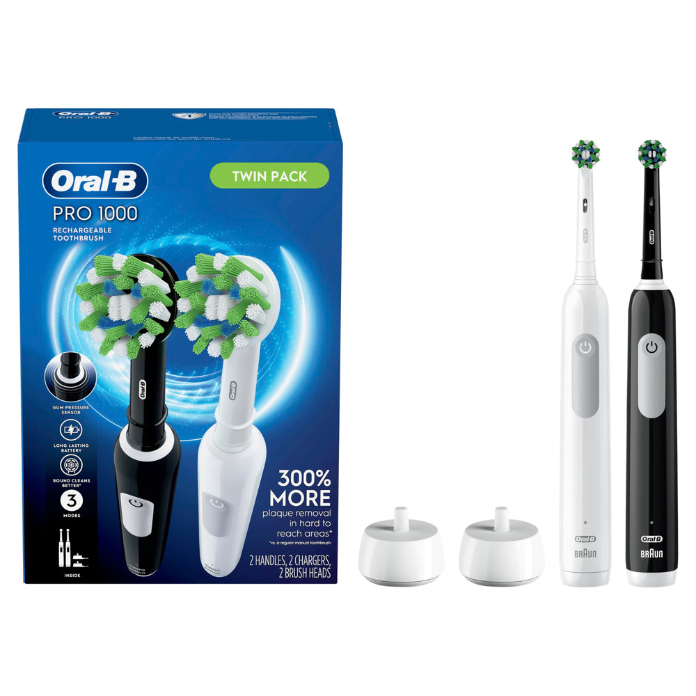 Two Oral-B Pro 1000 CrossAction electric toothbrushes in black and white (2-count pack).