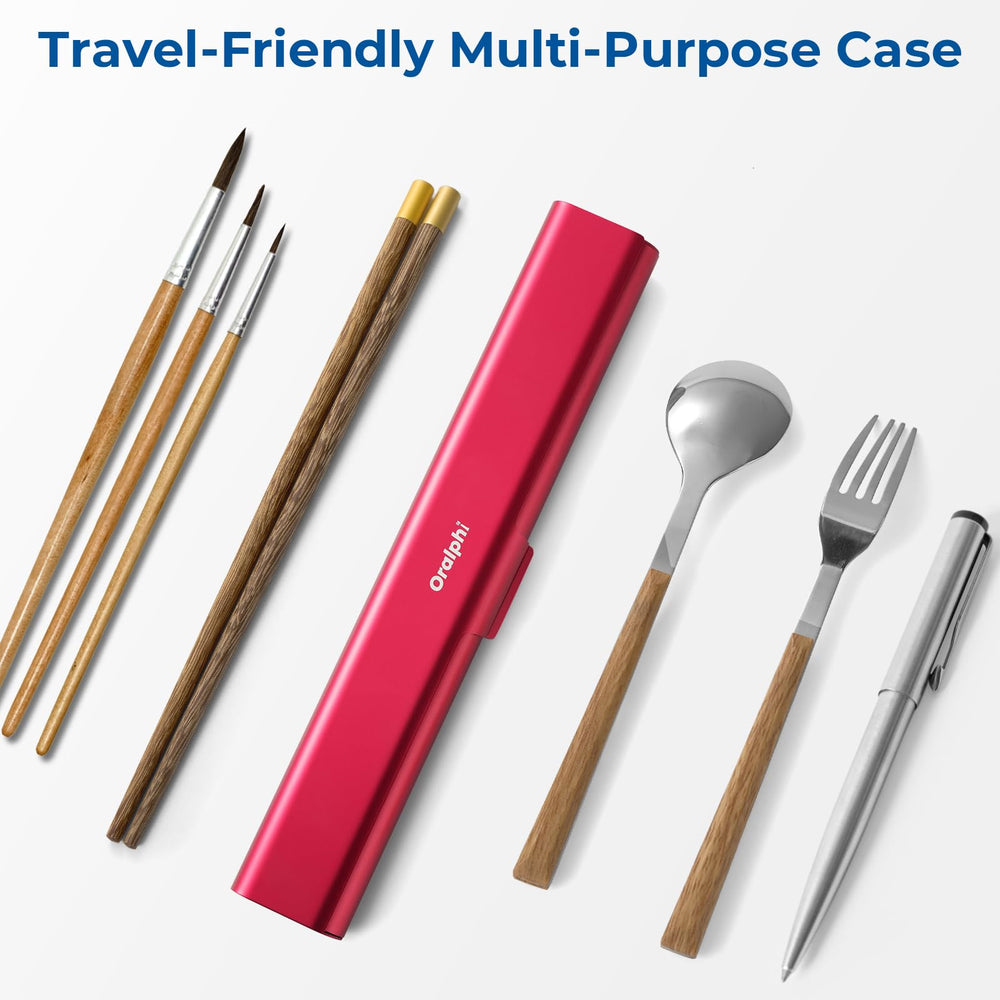 Oralphi red travel toothbrush case beside a suitcase for travel