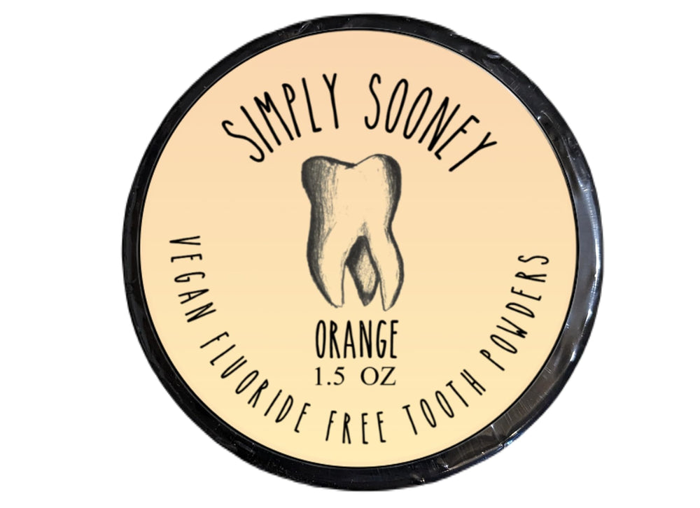 Orange-scent remineralizing tooth powder packaging close-up