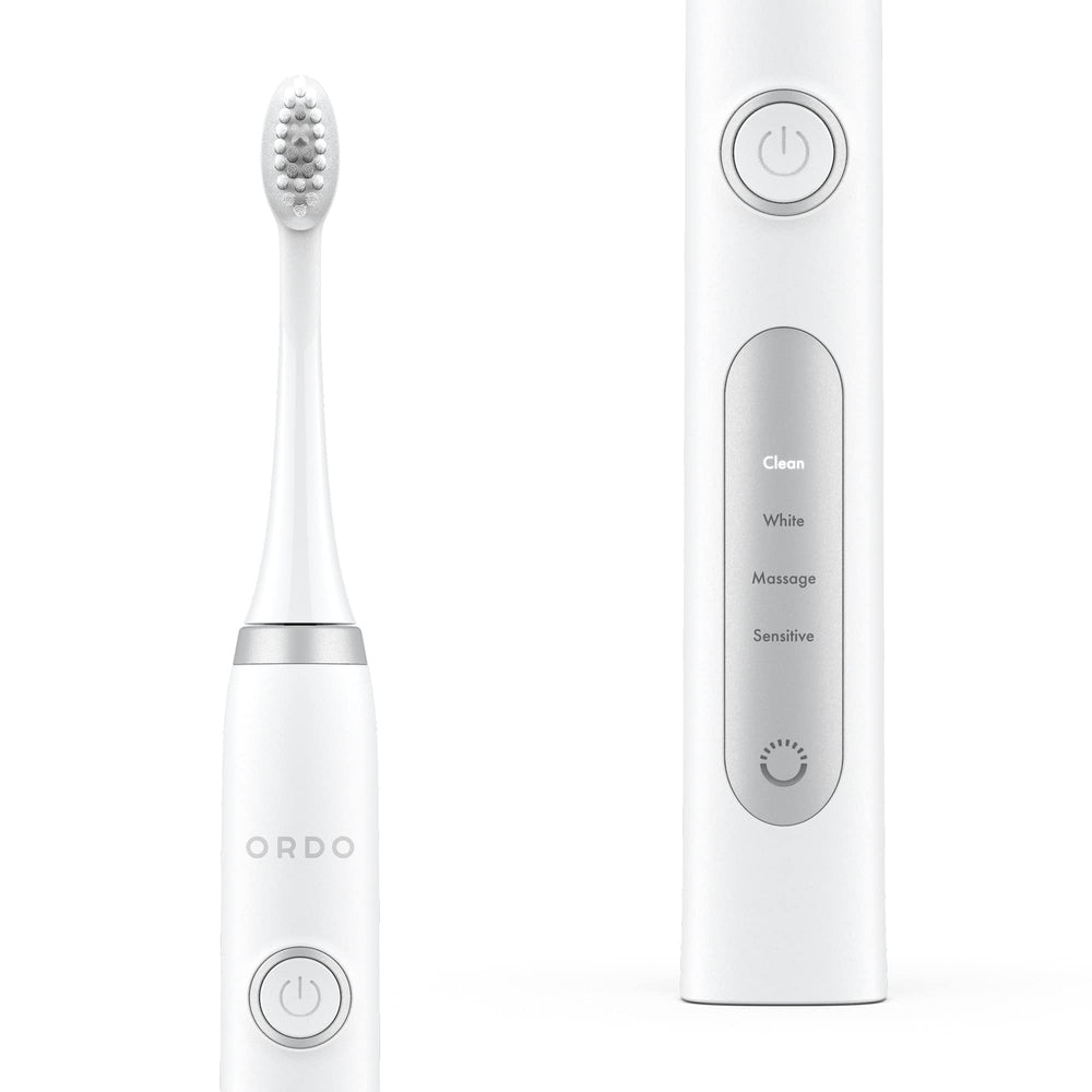 Close-up of Ordo Sonic+ toothbrush with white silver handle