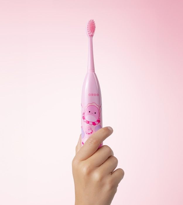 Child brushing teeth with ORDO Squishmallows toothbrush