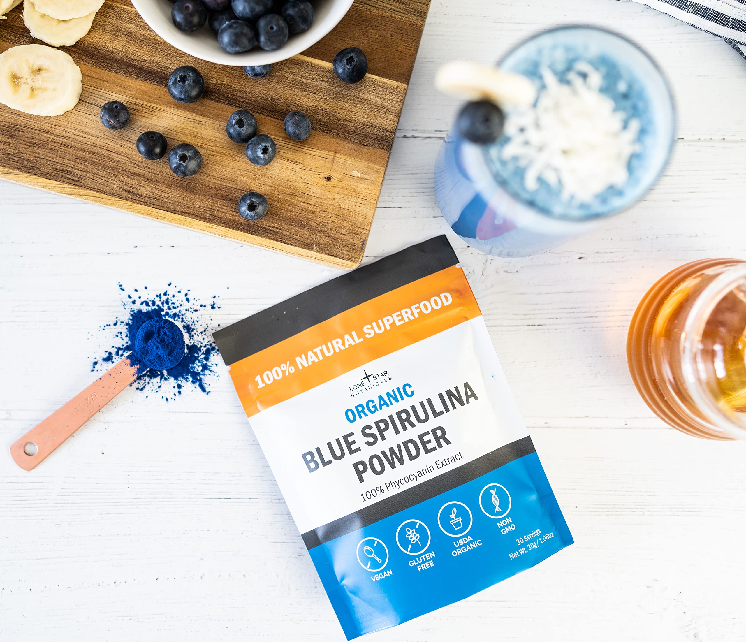 Blue spirulina powder added to a smoothie for vibrant color