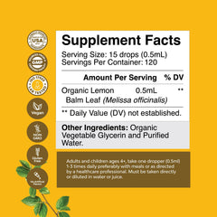 Dropper dispensing lemon balm tincture into glass bottle