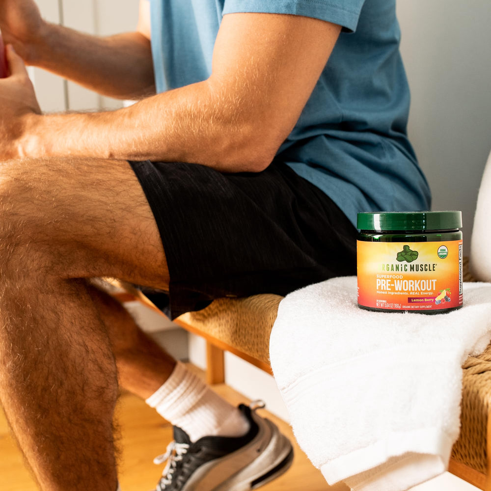 Organic Muscle pre-workout in a glass with water shows easy mix and refreshing flavor.