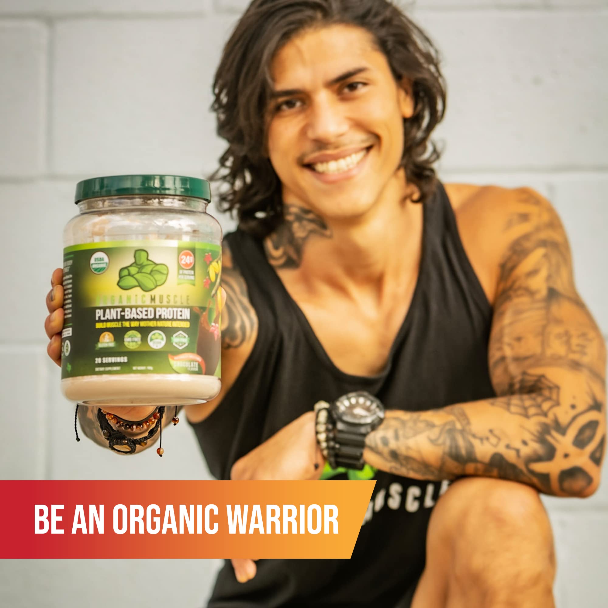 Glass of water with Organic Muscle Super Greens Powder