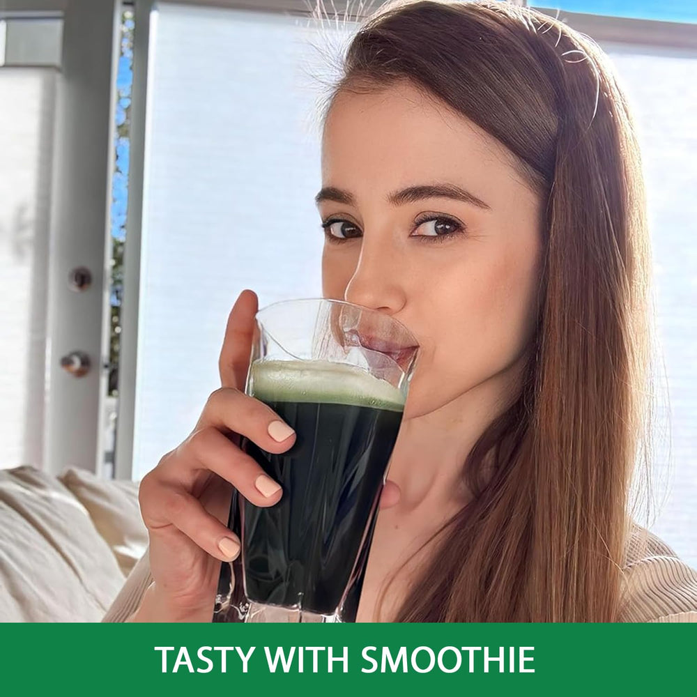 Organic spirulina powder with scoop in bowl