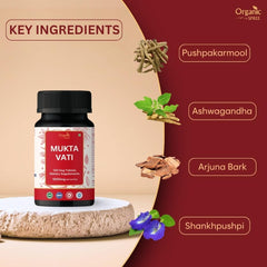 Close-up of Mukta Vati tablets and herbal blend