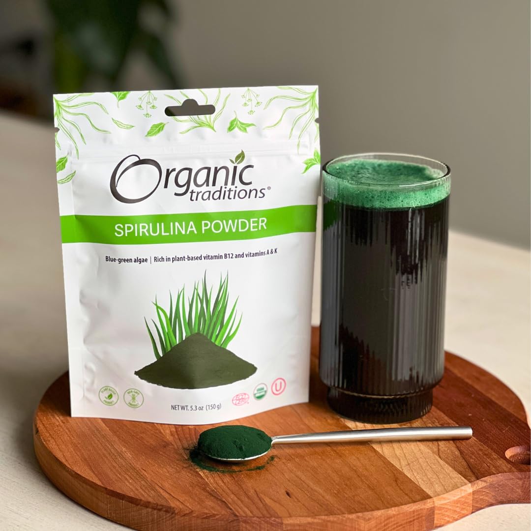 Spirulina powder poured into a glass of juice