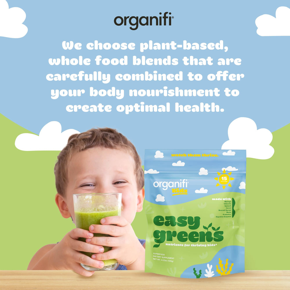 Happy child enjoying Organifi Kids Easy Greens drink