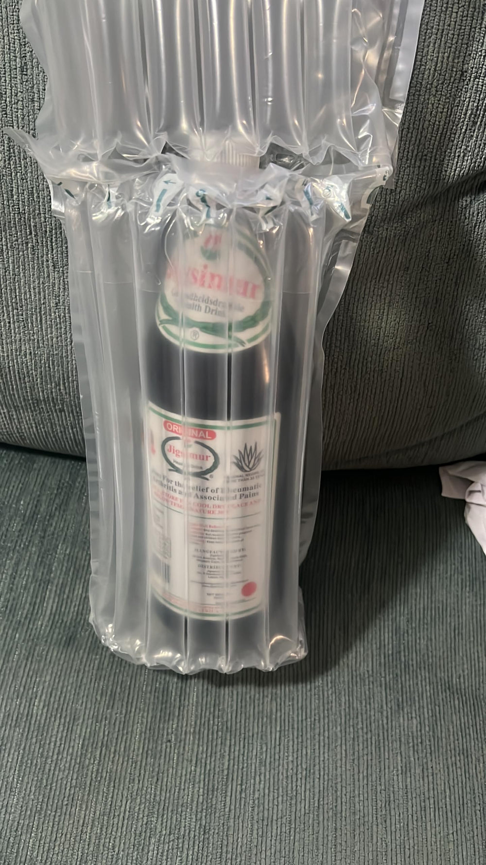 Herbal ingredients surrounding Jigsimur drink bottle