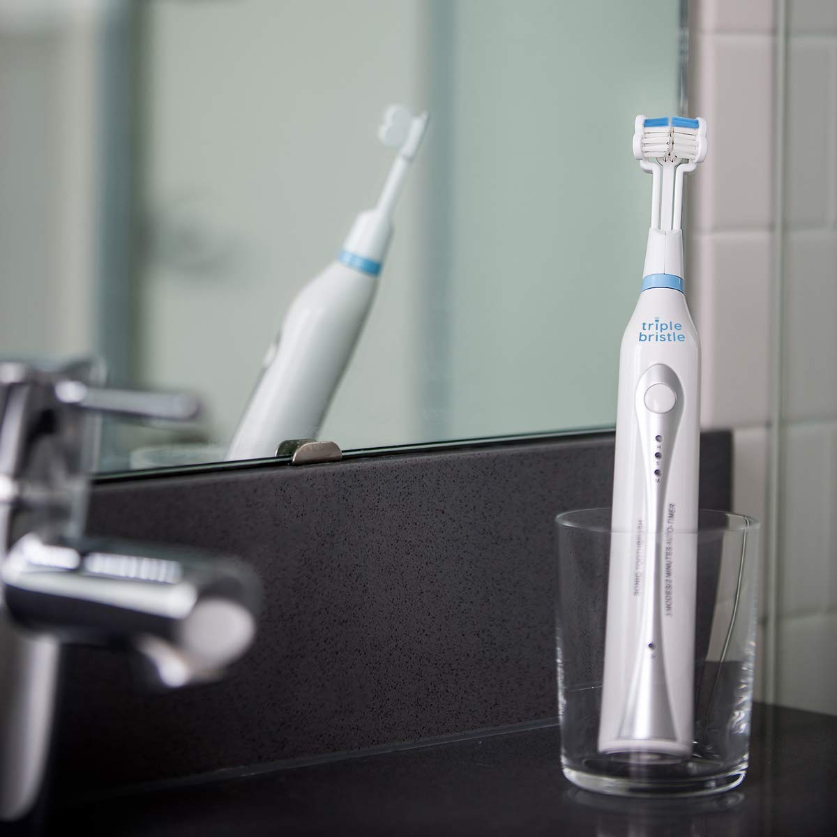 Person using the toothbrush showing 31,000 strokes per minute
