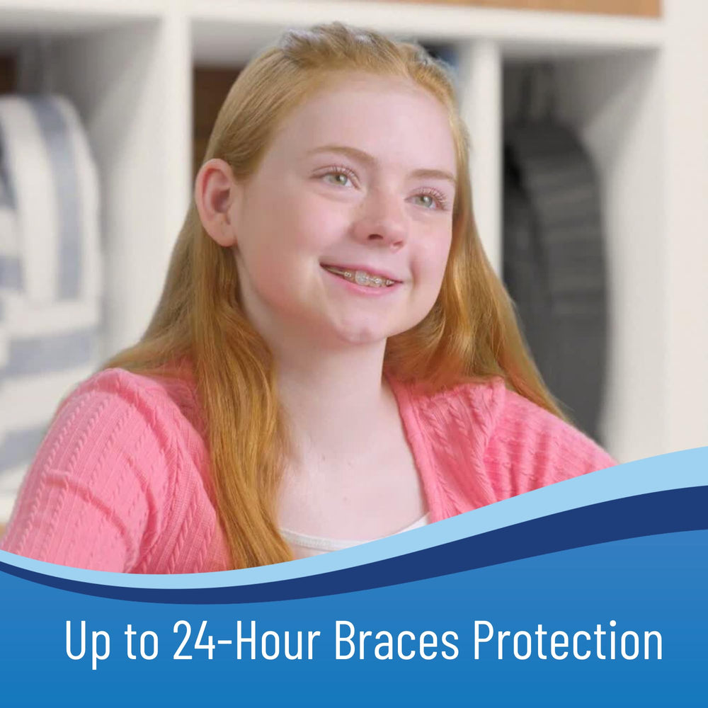 OrthoDots adhered to braces edge and clear aligner