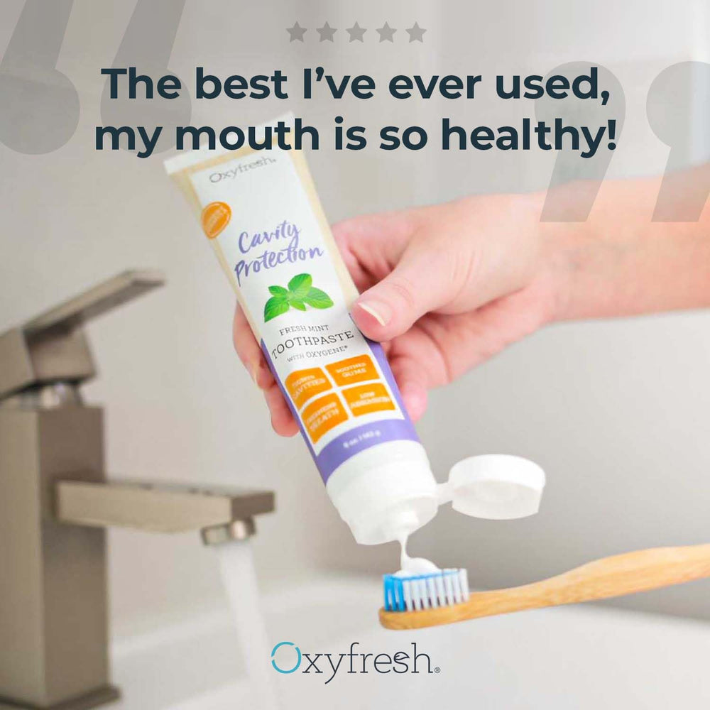 Close-up of toothpaste tube label and Fresh Mint branding