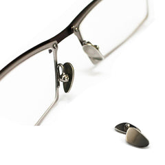 Packaging contents: nose pads, screws, and micro screwdriver