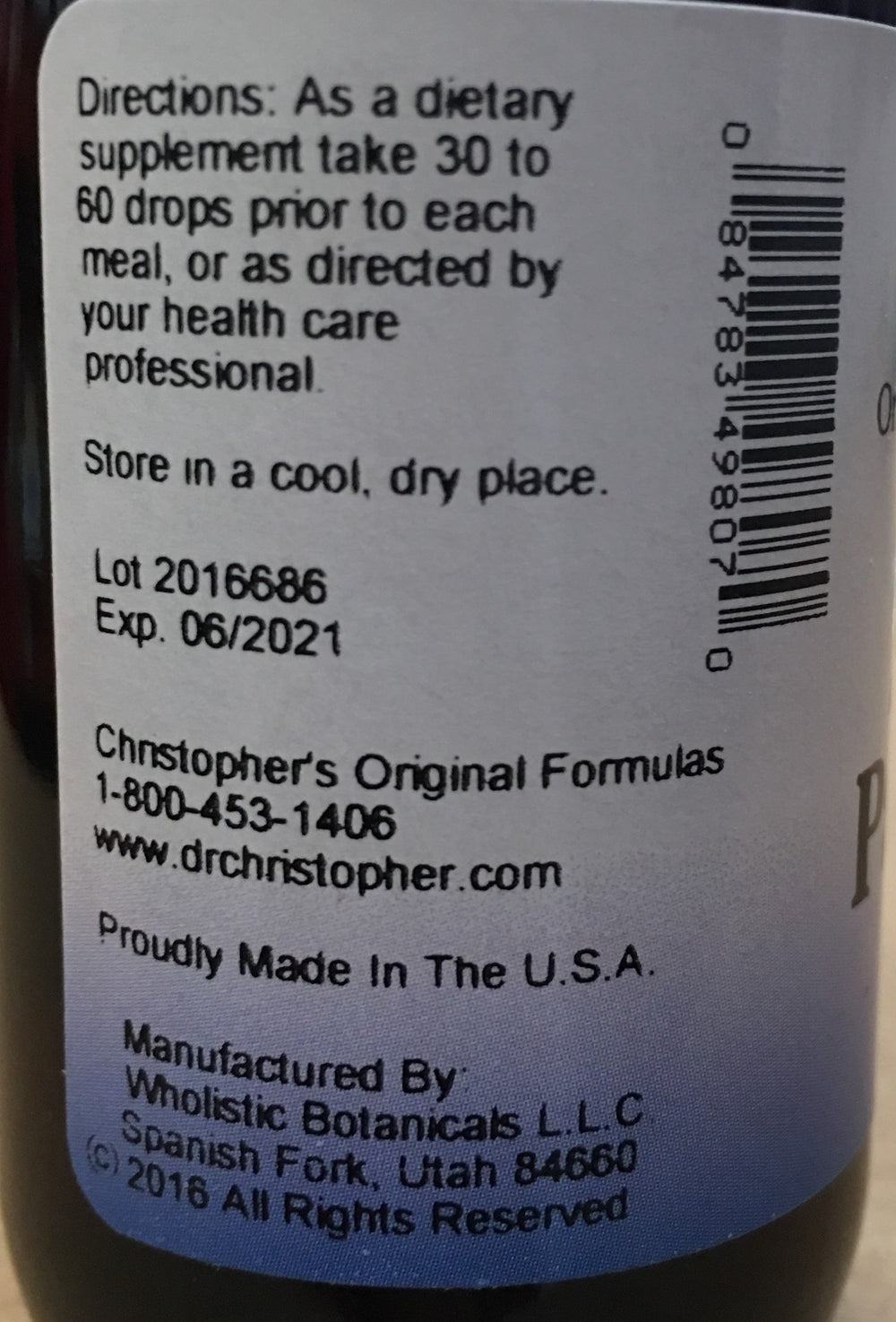 Dropper dispensing formula into a glass