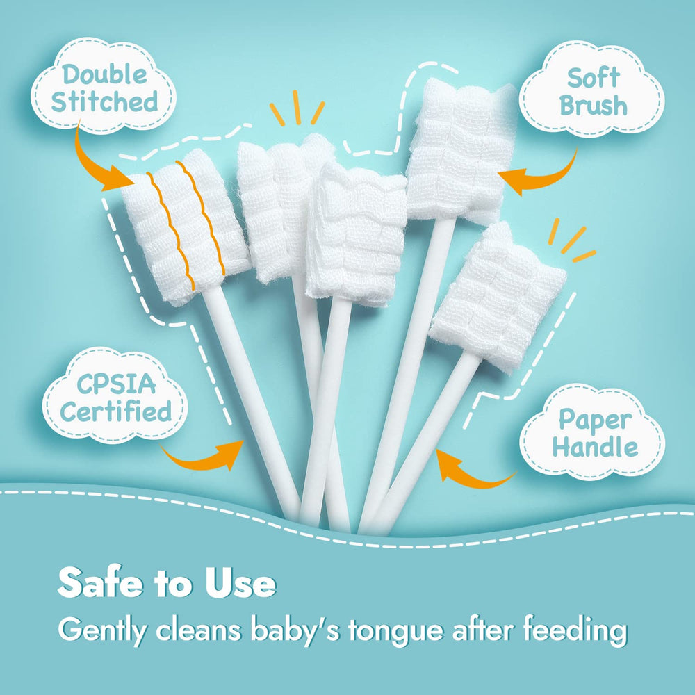Baby tongue cleaner being rubbed on gums after feeding