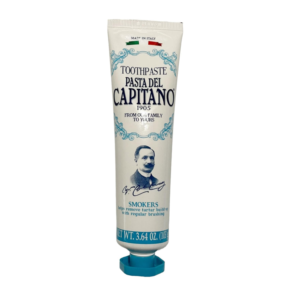 Toothpaste being squeezed onto a toothbrush with peppermint flavor