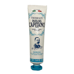 Toothpaste being squeezed onto a toothbrush with peppermint flavor