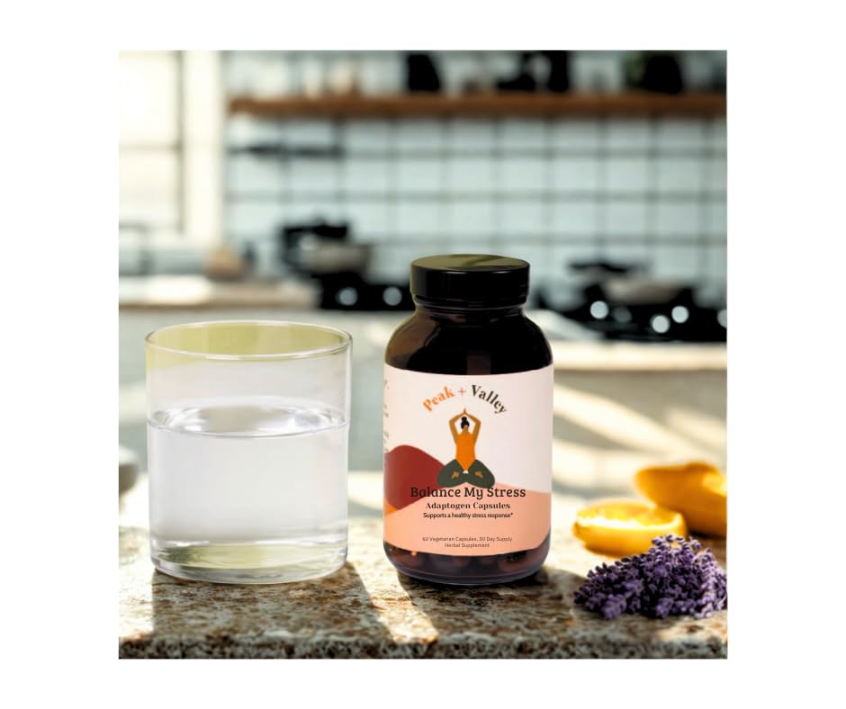 Adult taking stress relief capsules with water
