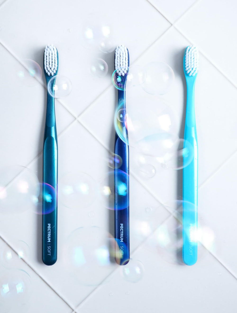 Open box showing 6 PECTRUS toothbrushes in assorted colors