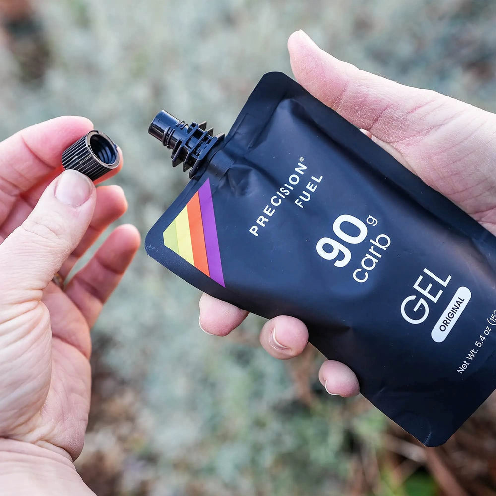 Precision Hydration PF90 Energy Gels during a run delivering convenient, easy-to-digest carbohydrates.