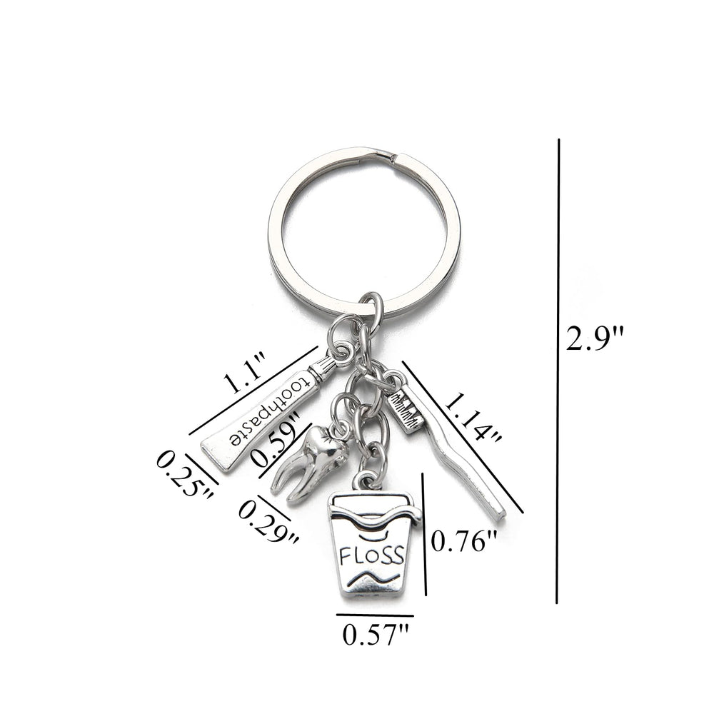 Close-up of zinc alloy toothbrush toothpaste keychain pendant