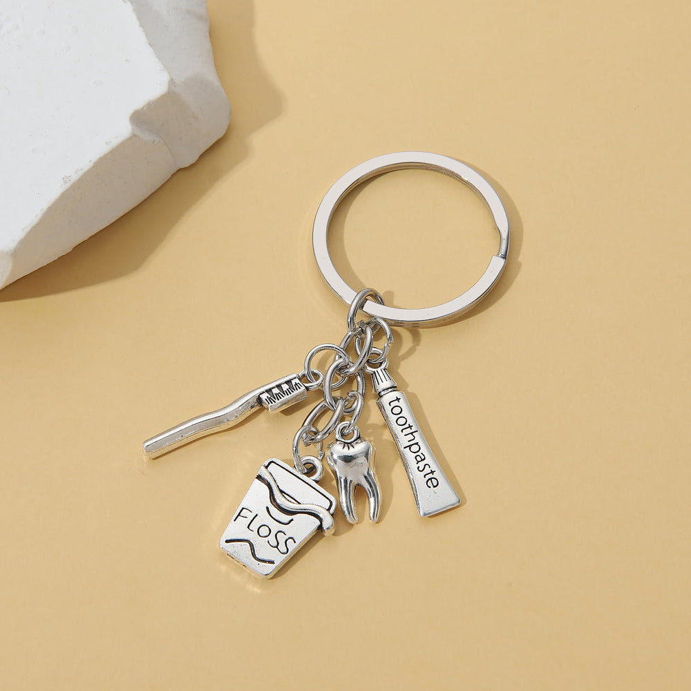 Package contents showing 20 pieces of toothbrush keychains