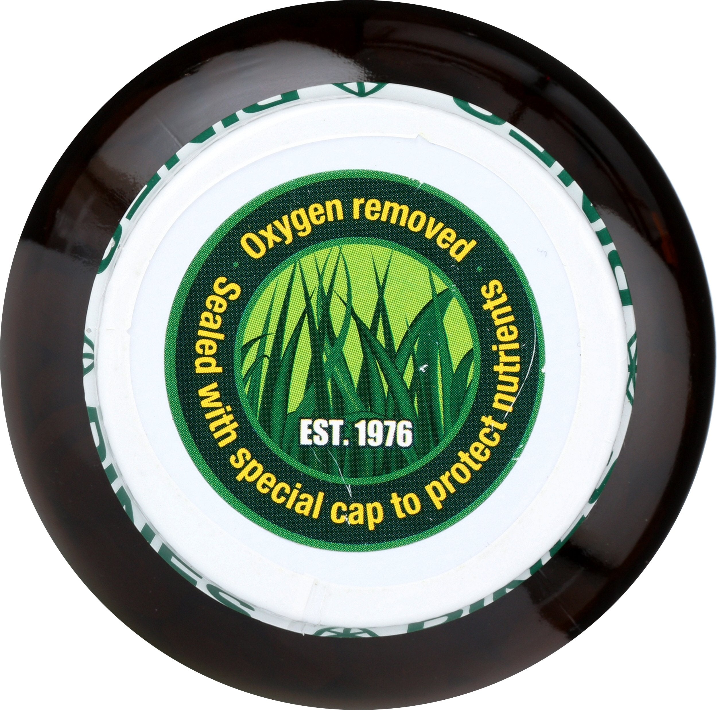 Pines Organic Barley Grass tablets close-up raw plant texture emphasizing plant-based nutrition