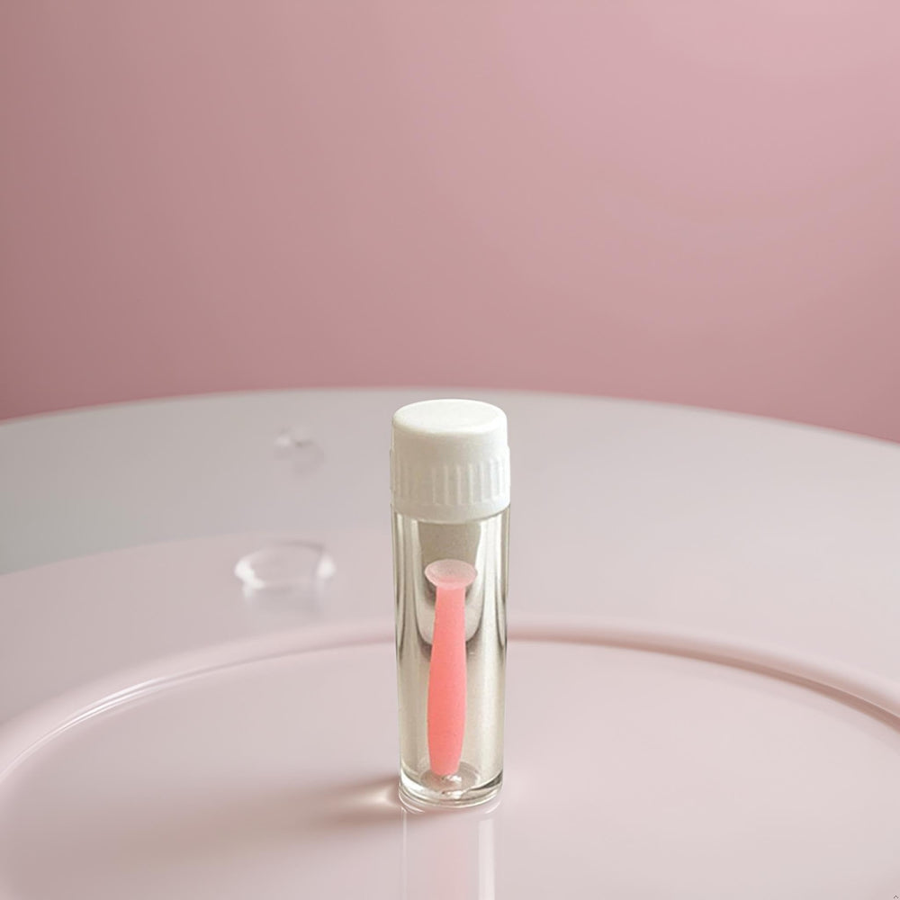 Travel-friendly pink case with insertion tool and lens storage