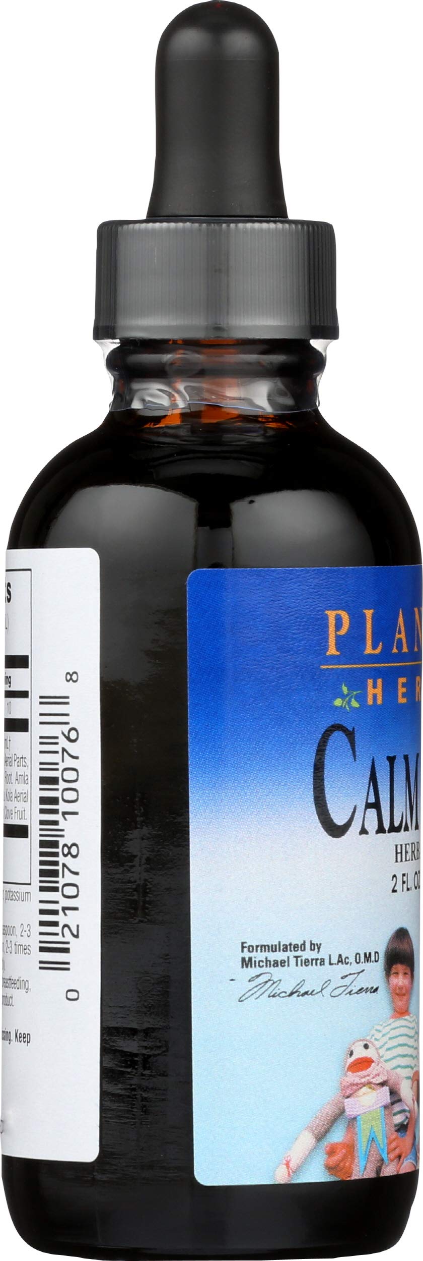 Close-up of Calm Child syrup bottle showing measurement markings