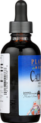 Close-up of Calm Child syrup bottle showing measurement markings
