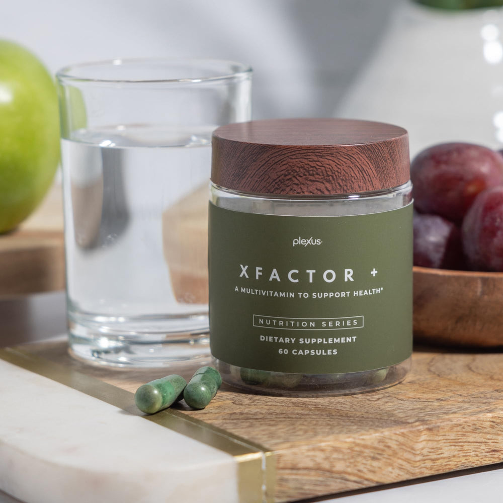 Close-up of Plexus Xfactor+® capsules being poured