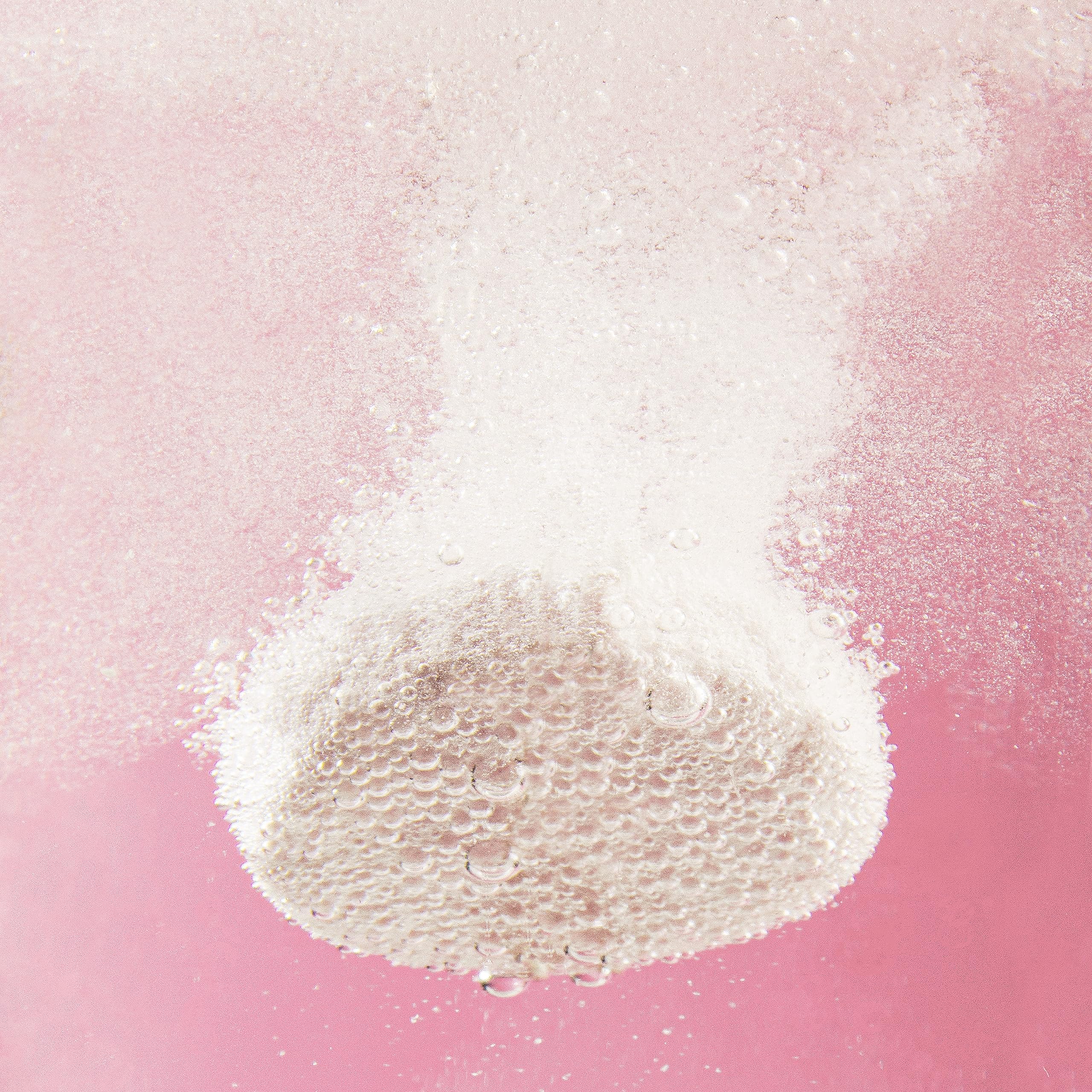 Water glass with fizz and berry aroma from Plink.