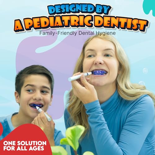 Teeth with purple plaque stain highlighting brushing gaps