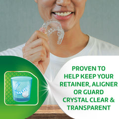 Denture soaking in Polident cleansing solution