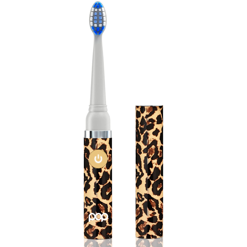 Leopard Go Sonic toothbrush with cap in hand