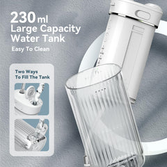 Compact travel-friendly water flosser with collapsible tank