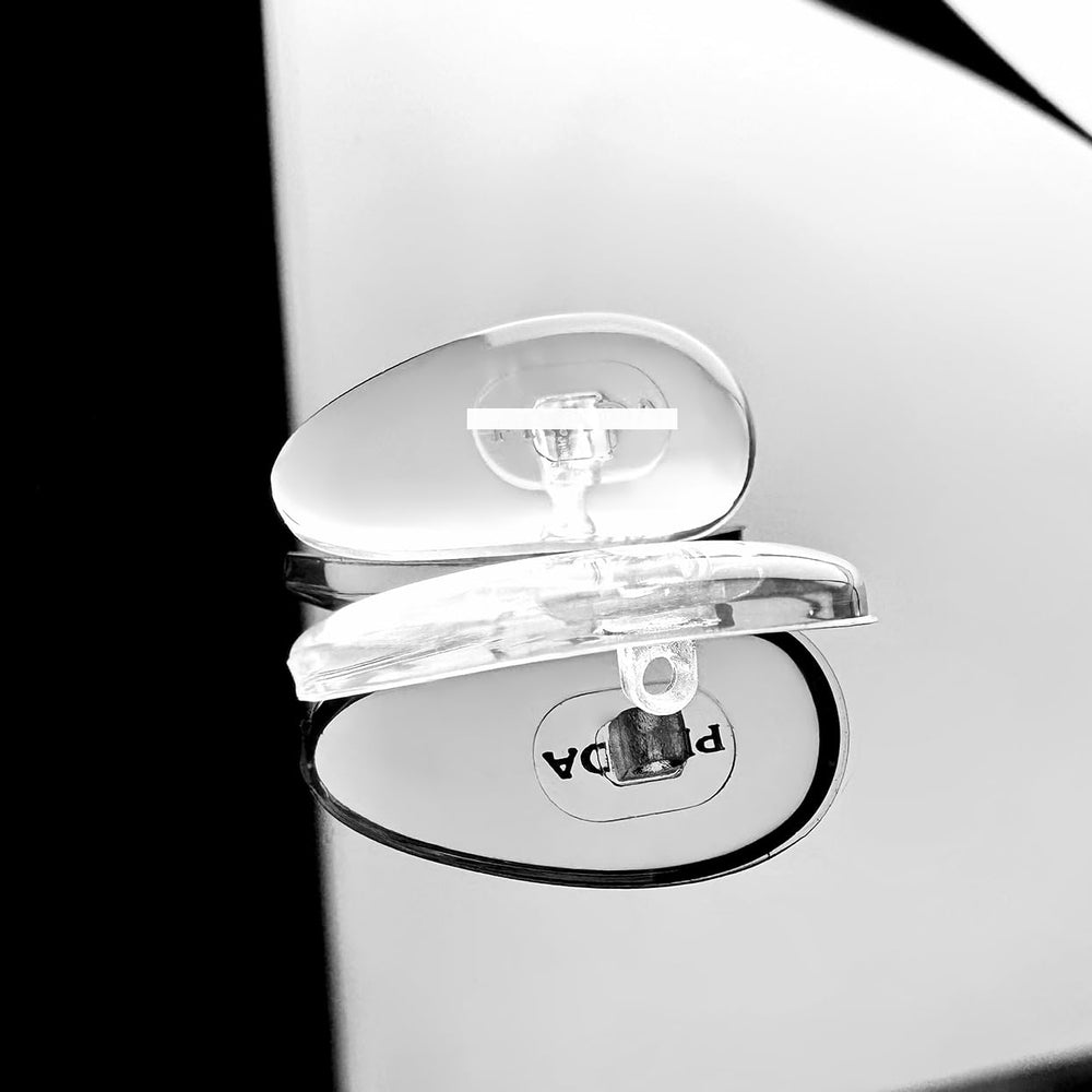 Close-up of Prada logo on nose pads with gold and silver options