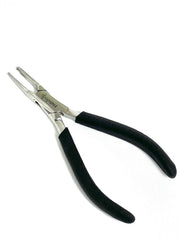 Eyeglass frames being repaired with nose pad pliers