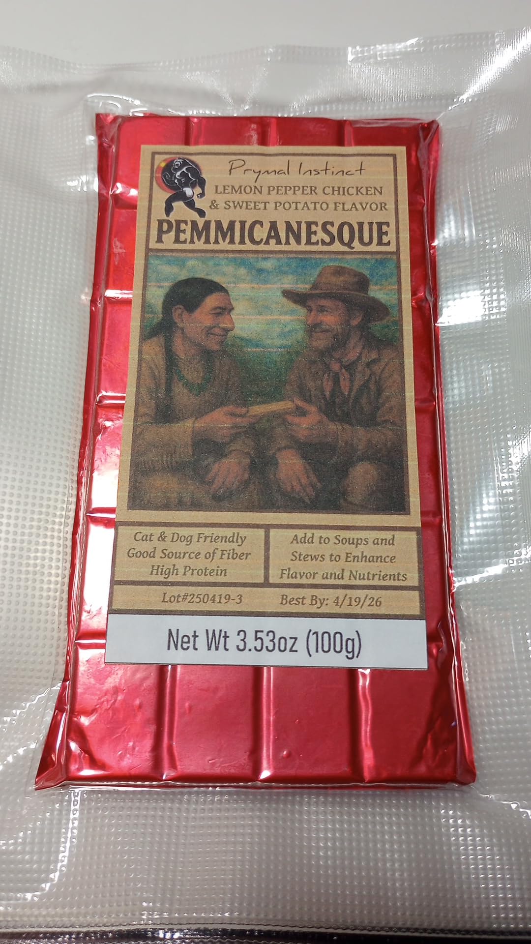 Prymal Instinct Pemmicanesque Lemon Pepper Chicken & Sweet Potato snack bar in packaging on a wooden surface