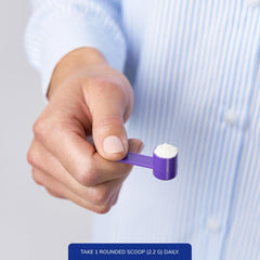 Pure Encapsulations Buffered Ascorbic Acid Powder measuring scoop demonstrates clean, additive-free vitamin C.