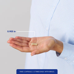 Herbal supplement bottle on neutral background with capsules