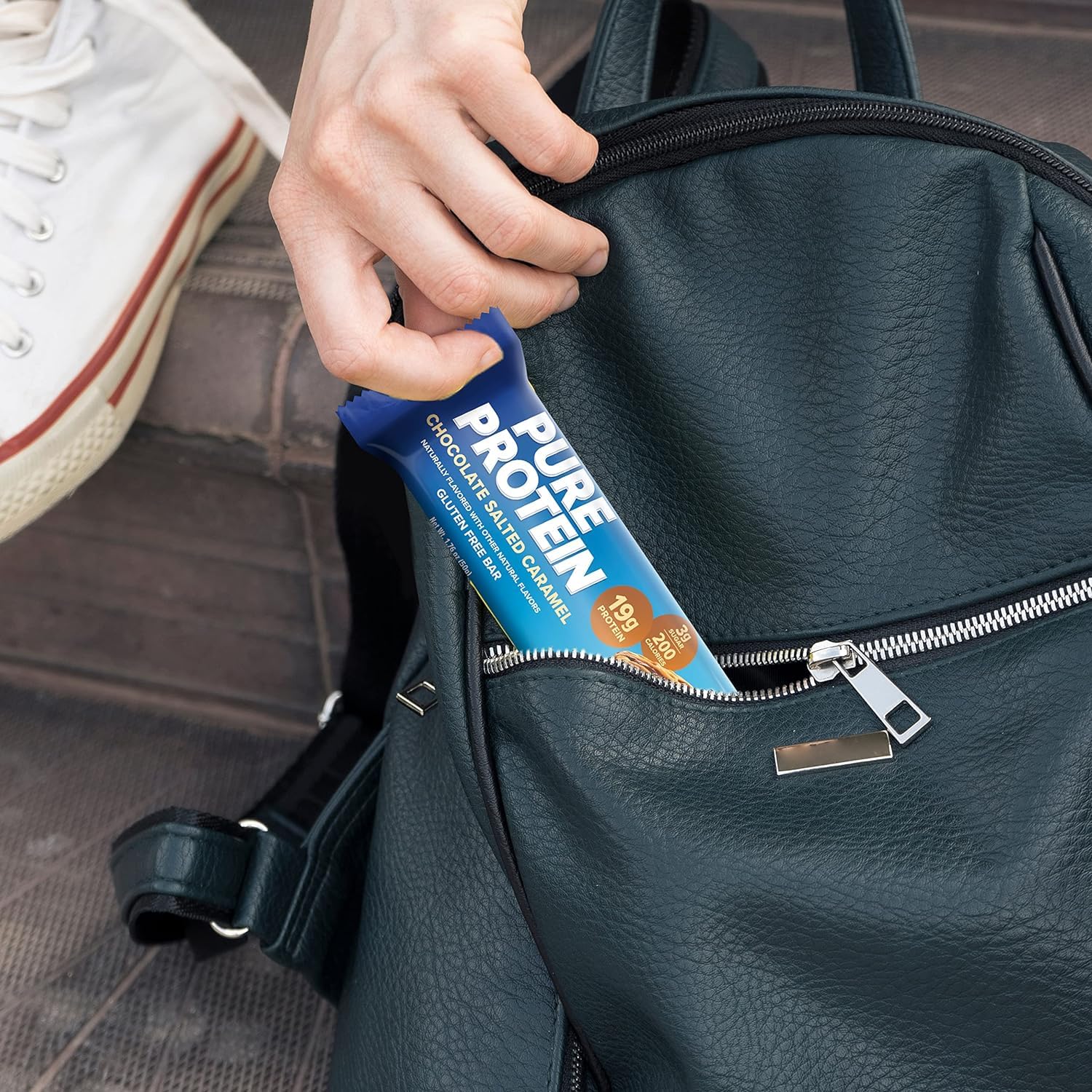 On-the-go Pure Protein Bar in gym bag for pre- or post-workout fueling
